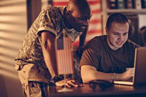 american soldiers using laptop