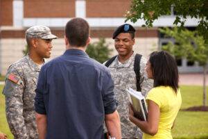 Students on campus talking with ROTC soldiers