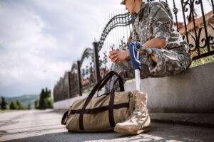 soldier with prosthetic leg waiting