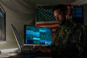 cyberspace soldier behind monitors