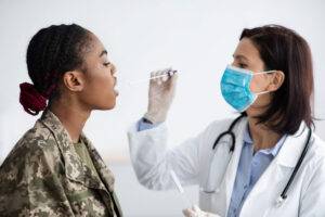 soldier giving a pcr test