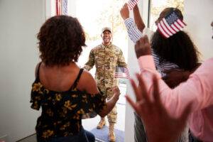 soldier surprised at front door with welcoming