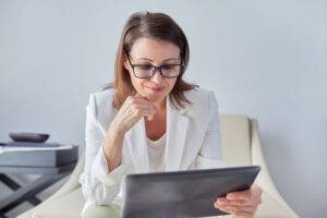 female psychologist looking at laptop