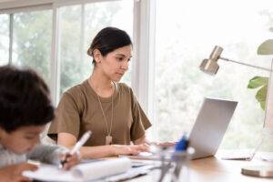 female soldier on computer at home