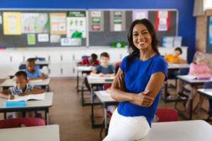 happy teaching smiling in classroom