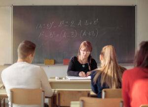 teacher in front of high school class