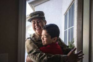 hugging son at the door