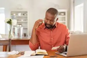 man studying on computer at home