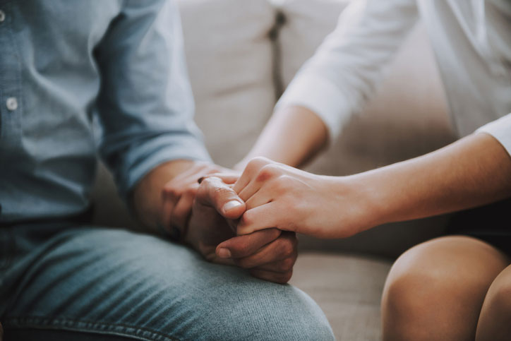 military widow holding hands