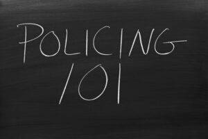 policing 101 on chalkboard