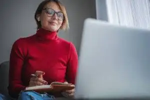 social worker on computer at home