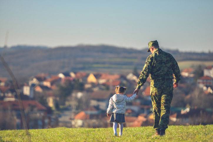 soldier taking daughter for a walk