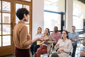 teacher presenting to adult students