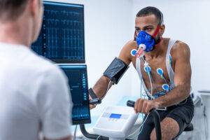 athlete riding stationary bike