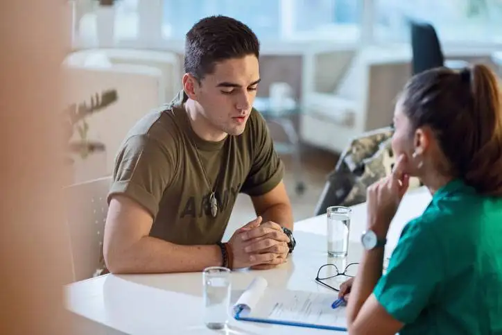 healthcare administration talking to young soldier