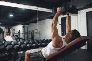 man doing dumbbell flys