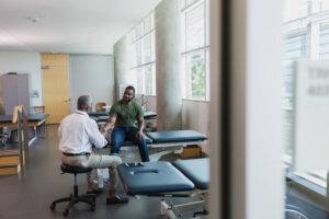 patient shaking hands with doctor