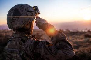 soldier saluting at sunset