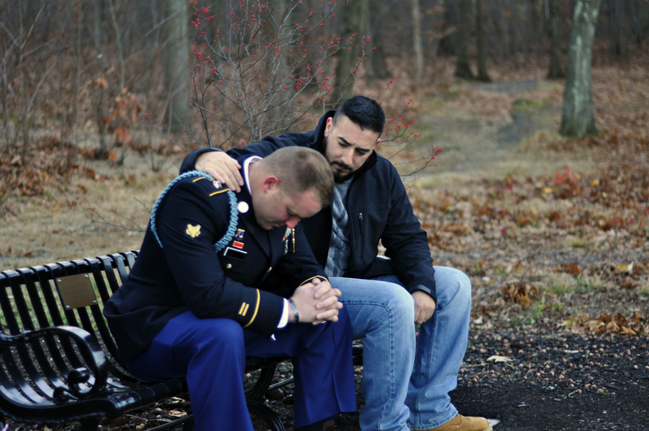 Friend Comforts Uniformed Army Soldier
