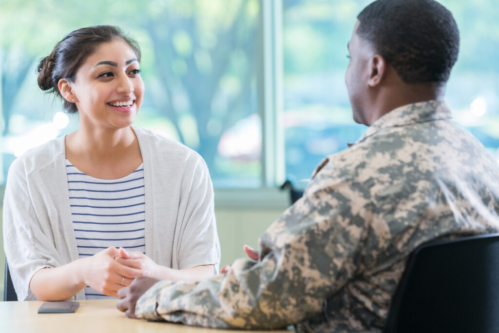 female mental health professional talks with soldier