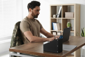 soldier working on computer